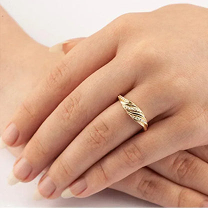 0.17 TDW Diamond Fancy Sparkling Twist Band in 10K Yellow Gold