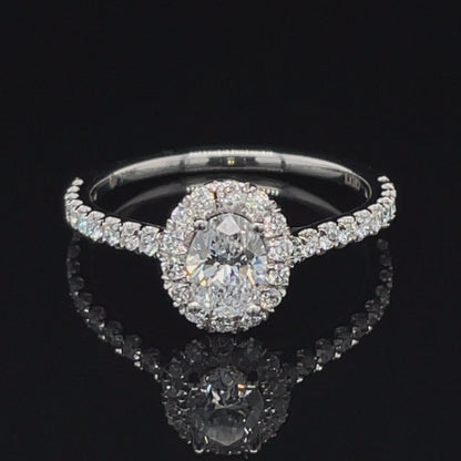 14K White Gold 0.84tdw Lab Grown Oval Halo Diamond Engagement Ring With Side Diamonds.