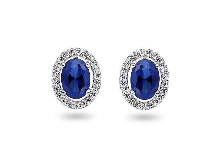 0.21TDW Diamond & 2.5X3MM Oval Sapphire Halo Earrings in 10k White Gold